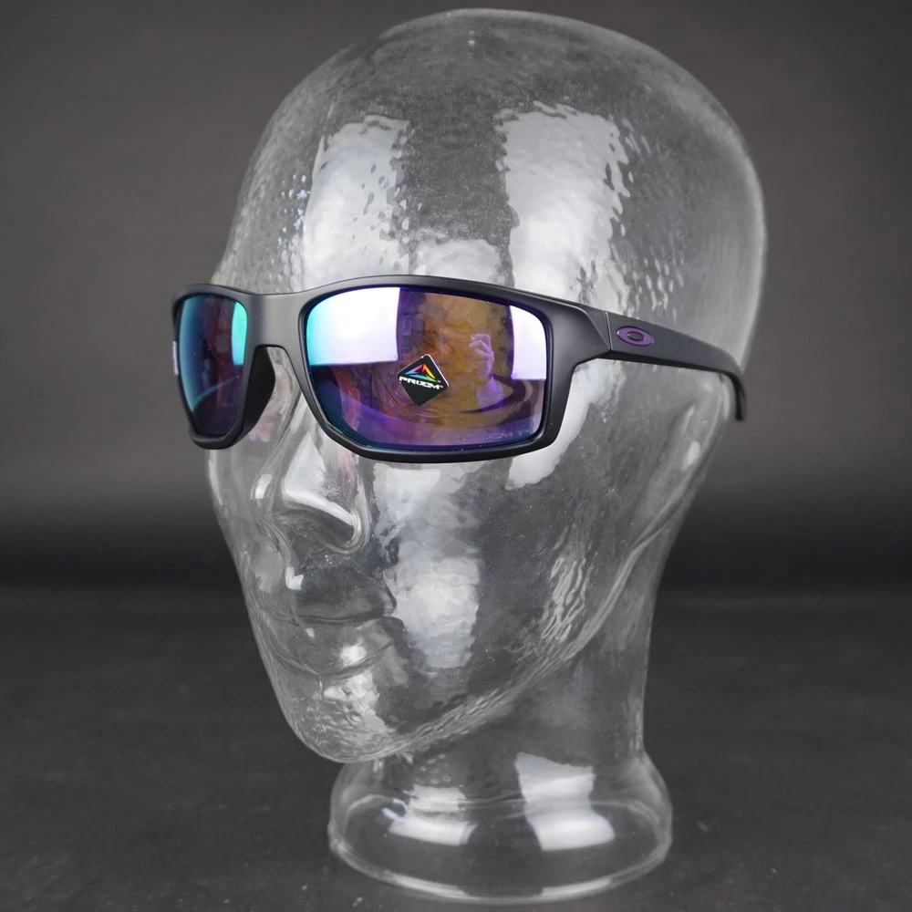 Oakley Gibston Sonnenbrille Matte Black/Prizm Violet Polarized Herren 7 Oakley Gibston Sonnenbrille Matte Black/Prizm Violet Polarized Herren – Bild 5